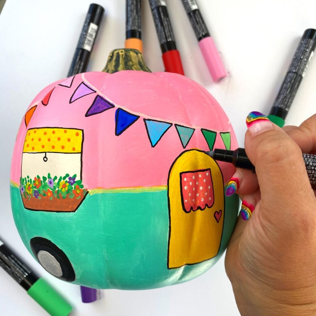 Outlining all the artwork with black marker