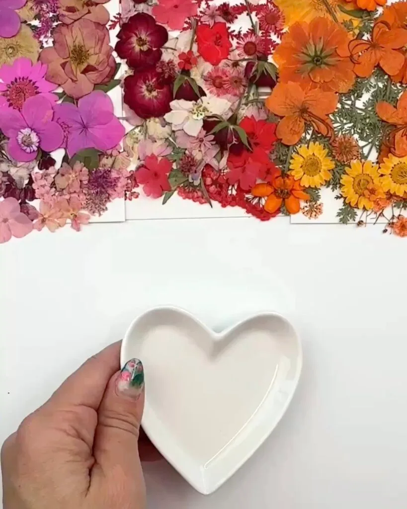 Pressed flowers and heart dish